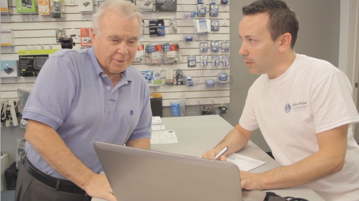 Customer receiving assistance inside the retail store